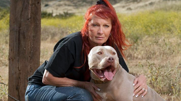 Image of Tia Maria Torres with her Pitbull